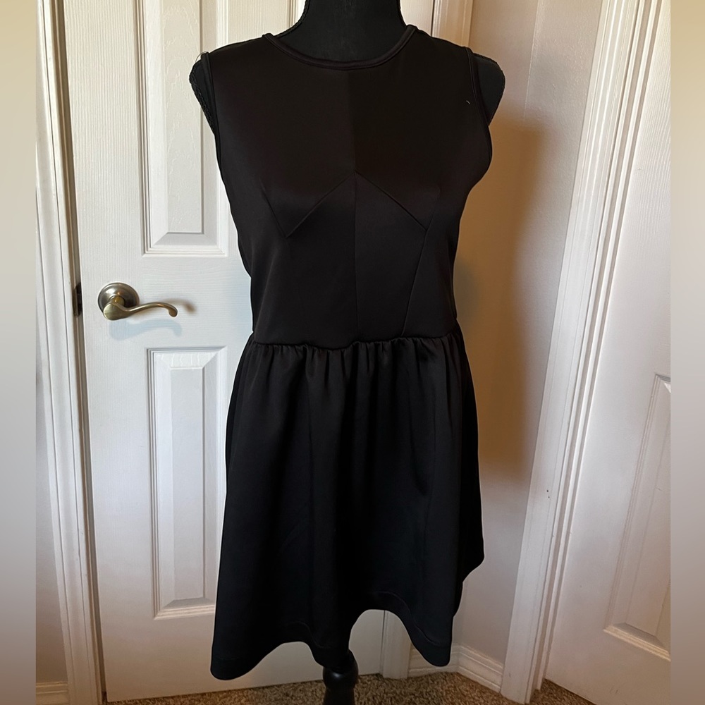 Black sleeveless mini dress sewing design on front
